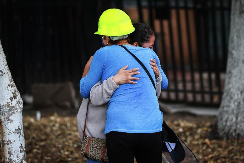 Residents of the Lindavista Housing Unit embrace after being evacuated from their homes due to the risk of collapse. Getty Images