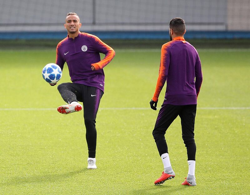 Danilo, left, controls a ball during a training session. PA via AP