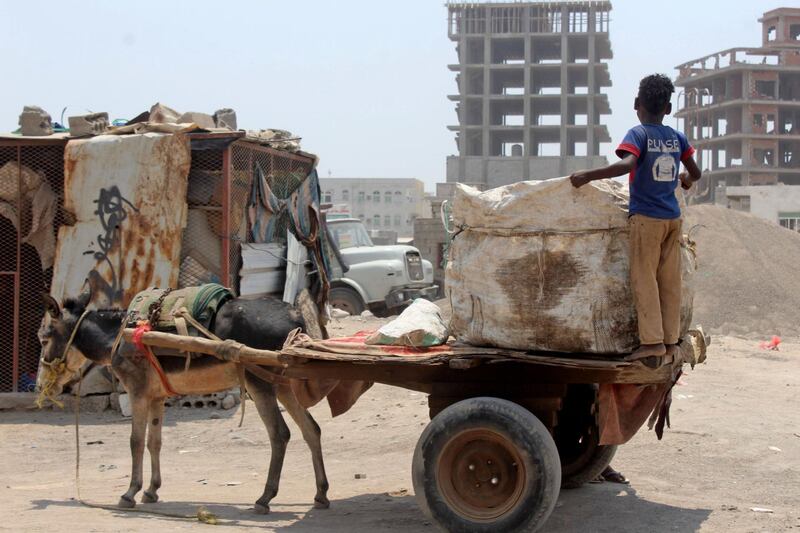 A donkey draws a loaded cart in the southern Yemeni city of Aden on September 16, 2020. AFP