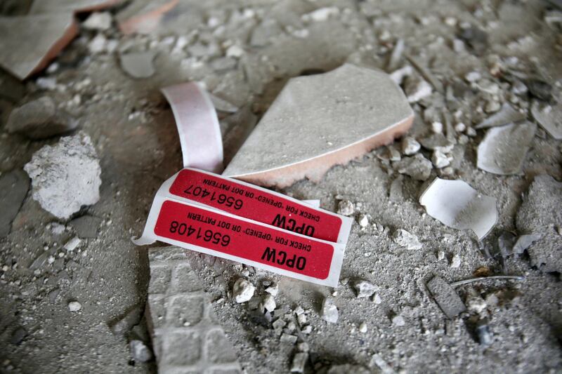 Labels of the Organisation for the Prohibition of Chemical Weapons (OPCW) are seen iside a damaged house in Douma in Damascus, Syria April 23, 2018. REUTERS/ Ali Hashisho