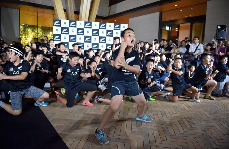 Japanese children perform the Haka during a welcome ceremony for the New Zealand All Blacks team upon their arrival at a hotel in Kashiwa, Chiba prefecture on September 9, 2019, ahead of the start of the 2019 Rugby World Cup on September 20.  / AFP / Kazuhiro NOGI
