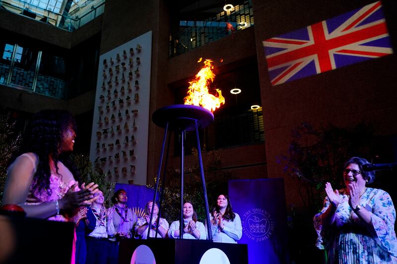 A platinum jubilee beacon is lit at Coutts bank in central London, Thursday June 2, 2022, on day one of Queen Elizabeth II's platinum Jubilee celebrations. PA