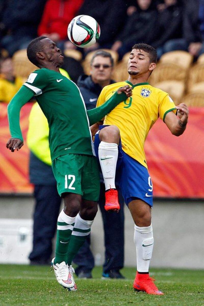 Ifeanyi Ifeanyi, left, of Nigeria and Judivan of Brazil contest the ball during a Fifa Under-20 World Cup 2015 match in New Plymouth, New Zealand, 01 June 2015. EPA/DEAN PEMBERTON