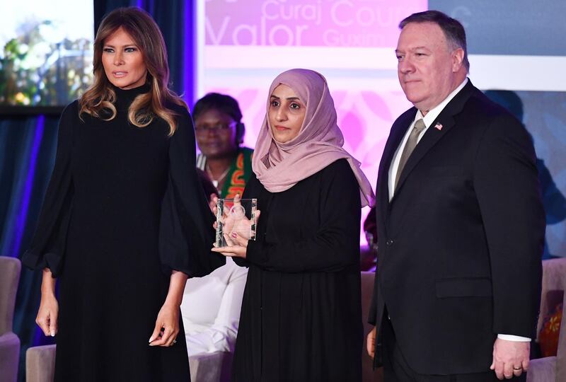 International Women of Courage Award recipient Yasmin al Qadhi of Yemen poses with US Secretary of State Mike Pompeo and First Lady Melania Trump.  AFP