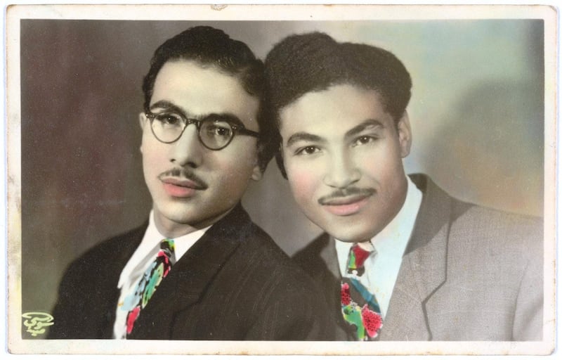 Hand-coloured portrait of Hussein and Ahmed Assad by Anis el Soussi in Lebanon, January 1, 1946, gelatin silver developing-out paper print (recto-verso). Fahime Zeidan Collection, courtesy of the Arab Image Foundation