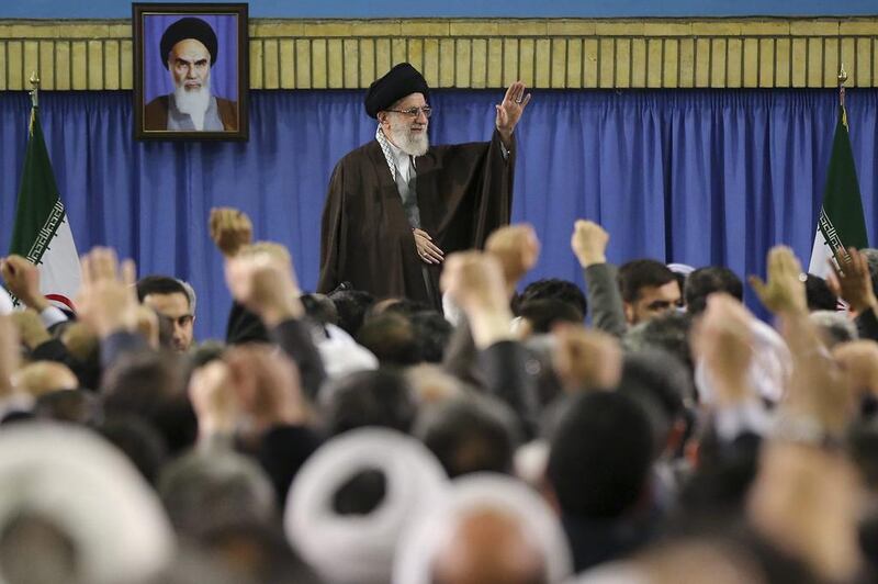 In this picture released by an official website of the office of the Iranian supreme leader, Supreme Leader Ayatollah Ali Khamenei waves while attending a meeting with a group of environmental officials and activists at his residence in Tehran on March 8. AP
