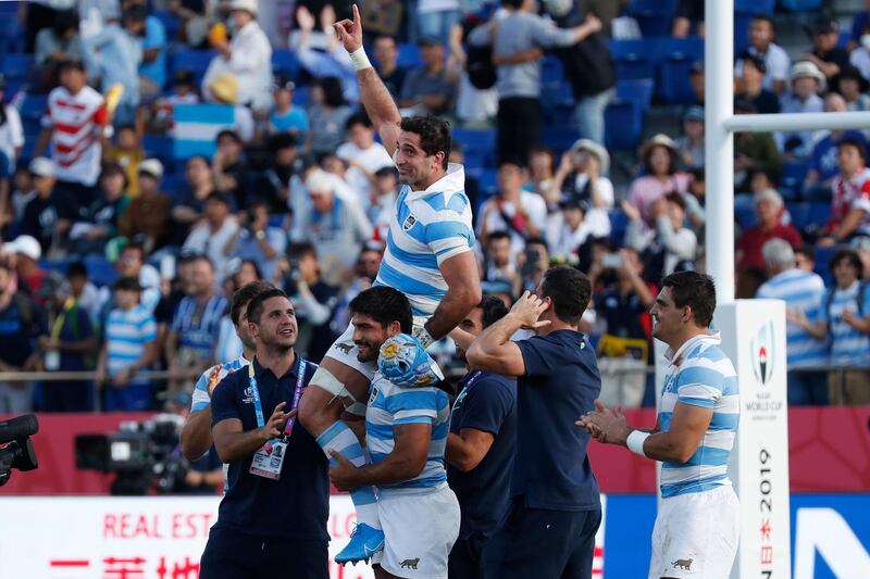Argentina's flanker Juan Manuel Leguizamon (top) gestures as he is carried by teammates after the Japan 2019 Rugby World Cup Pool C match between Argentina and the United States at the Kumagaya Rugby Stadium in Kumagaya. AFP