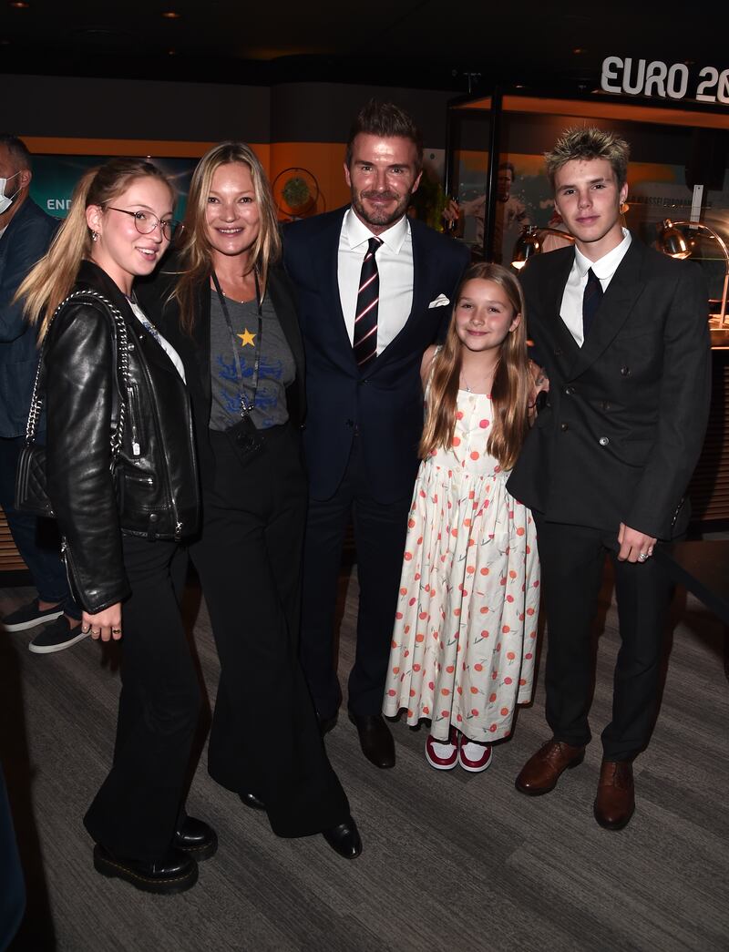 Lila Moss, Kate Moss, David Beckham, Harper Beckham and Cruz Beckham pose for a photograph prior to the Euro 2020 Championship Final.