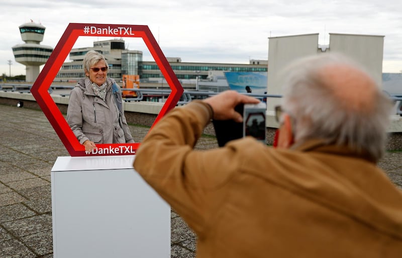 A visitor takes photos before Tegel Airport closes. Reuters