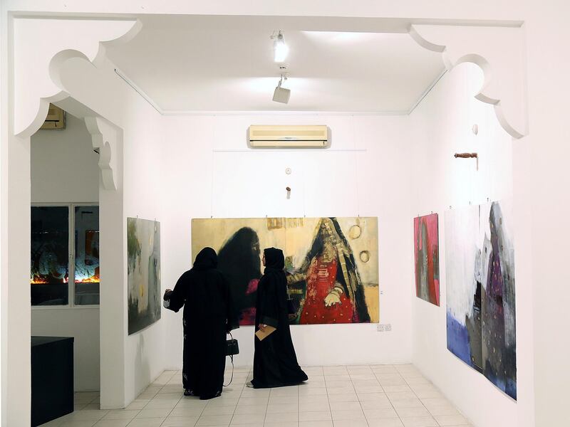 Dubai, March 20, 2018: Visitors take a look at the arts displayed at the Fatma Lootah Gallery during the Sikka Art fair at Al Fahidi Historical District in Dubai. Satish Kumar for the National
