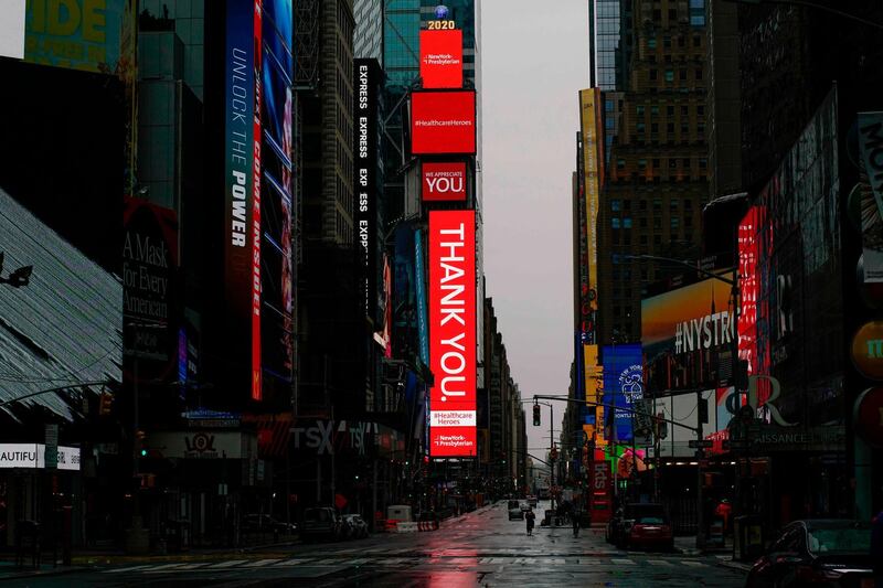 A empty Street is seen in Times Square amid the coronavirus pandemic in New York City. New York, which has ground to a halt to stop the coronavirus pandemic, may start reopening manufacturing and construction after May 15, Governor Andrew Cuomo said April 26, 2020.  AFP