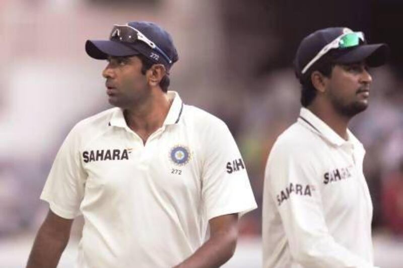 Ravichandran Ashwin, left, and Pragyan Ojha, during a Test match between India and New Zealand in August, are still some way away from becoming finished products as the series against England has shown. Noah Seelam / AFP