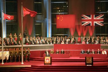Former Chinese President Jiang Zemin addresses delegates following the raising of the Chinese and Hong Kong SAR flags on July 1, 1997, as Hong Kong returns to China after more than 156 years under British rule. AFP