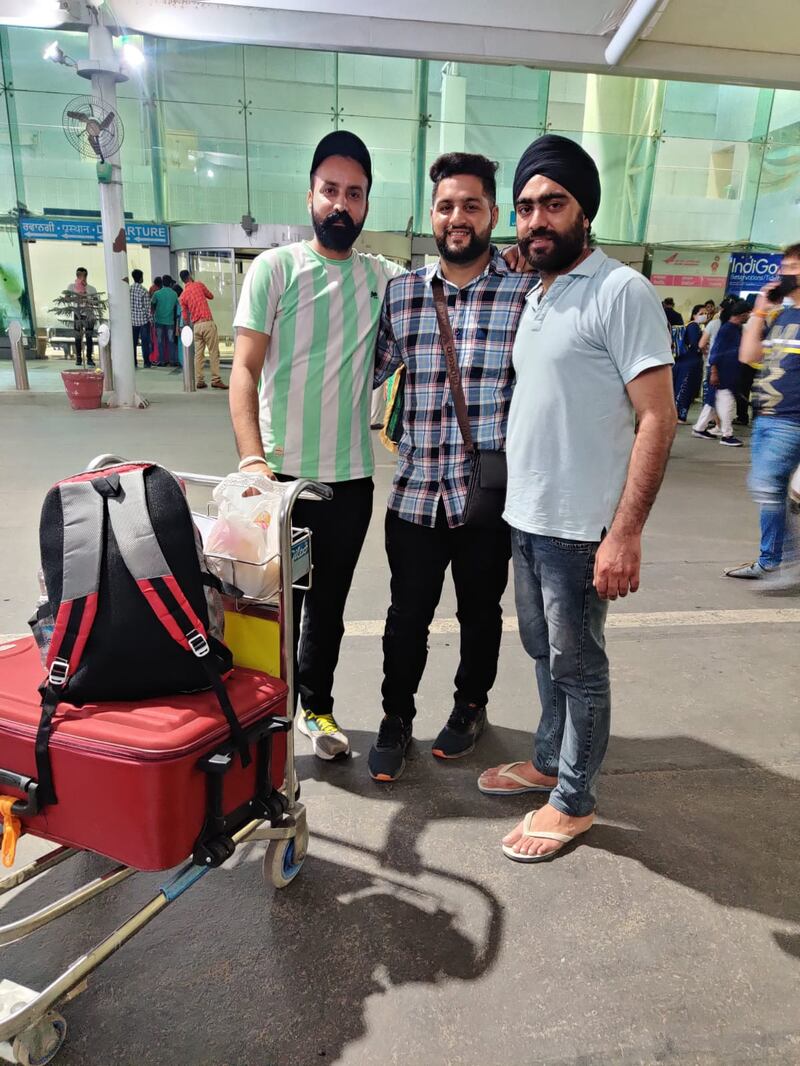 Singh, centre, with relatives outside Amritsar airport, in October last year, before heading back to the UAE. Photo: Singh family