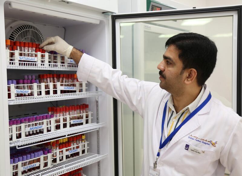 Lab Technician Satya Mitra Arya is seen at the Haematology and Biochemistry lab at the Dubai Camel Hospital in Dubai. Satish Kumar / Reuters