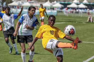 Uganda take on India in the Special Olympics women's football in Abu Dhabi on Monday. Victor Besa / The National 