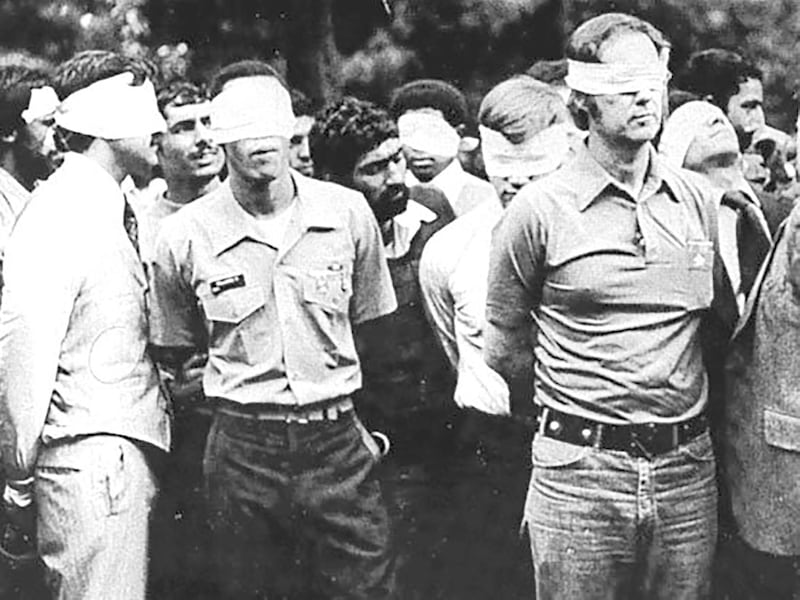 FILE PHOTO: Blindfolded U.S. hostages and their Iranian captors outside the U.S. embassy in Tehran, Iran, 1979. U.S. Army/Handout via REUTERS/File Photo ATTENTION EDITORS - THIS IMAGE WAS PROVIDED BY A THIRD PARTY PLEASE SEARCH  "FROM THE FILES -  IRAN MARKS 40TH ANNIVERSARY OF ISLAMIC REVOLUTION" FOR ALL PICTURES