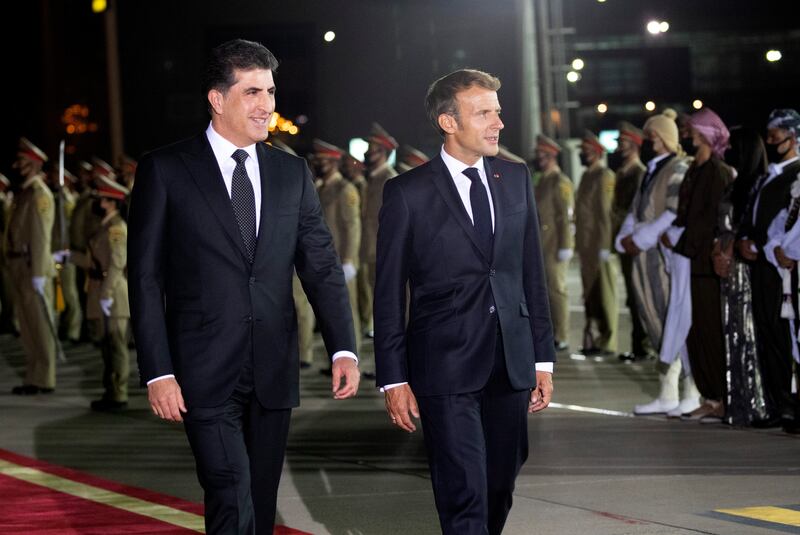 Kurdish President Nechirvan Barzani, left, receives French President Emmanuel Macron in Erbil. Photo: AP