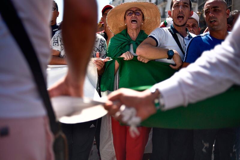 Protesters chant slogans during a demonstration against the ruling class in Algeria's capital Algiers.  AFP