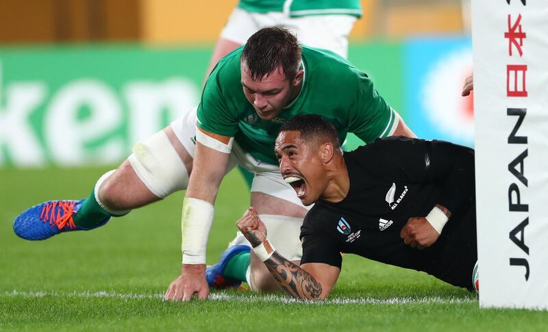 CHOFU, JAPAN - OCTOBER 19: New Zealand All Blacks player Aaron Smith celebrates his first try as Peter O' Mahony of Ireland (l) looks on during the Rugby World Cup 2019 Quarter Final match between New Zealand and Ireland at the Tokyo Stadium on October 19, 2019 in Chofu, Tokyo, Japan. (Photo by Stu Forster/Getty Images)