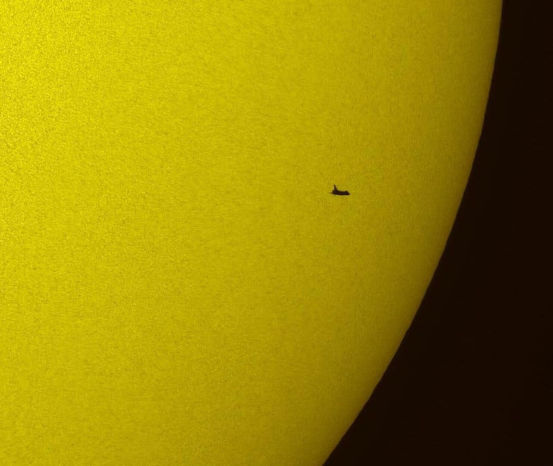   FILE - This Tuesday, May 12, 2009 picture made available by NASA shows the space shuttle Atlantis silhouetted against the sun. (AP Photo/NASA, Thierry Legault) *** Local Caption ***  Space Shuttle Legacy.JPEG-01ebc.jpg