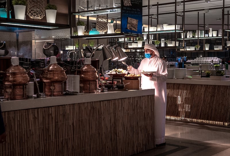 A chef awaits customers arriving to break their fast at Sim Sim.