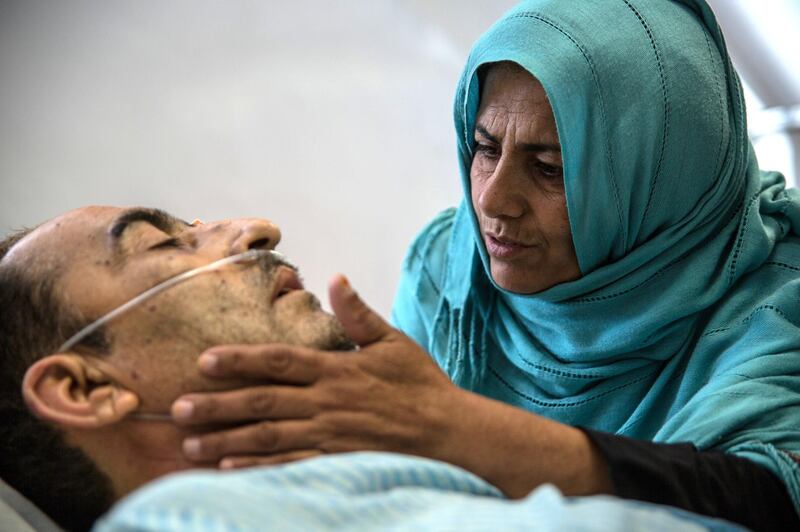 Shir Ali, 49, lies in hospital with his wife Qudsia, 48, by his side. The shock and pain of Monday's attack is raw. 