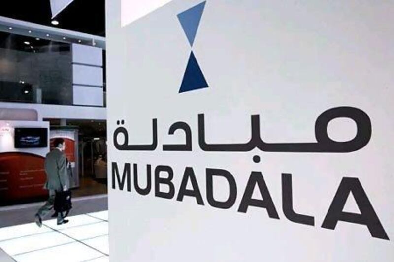 Mubadala Development, a strategic investment company owned by the Abu Dhabi Government, is among the first to benefit from an initial public offering announced yesterday by the Carlyle Group. Stephen Lock / The National