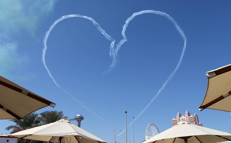 The Al Fursan National Aerobatic Team create a heart in the sky. AFP