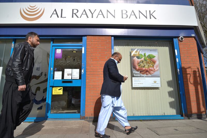 People passing a branch of the Al-Rayan Bank, formerly the Islamic Bank of Britain, in Manchester, Greater Manchester, England, United Kingdom on Wednesday 30th March 2016.  The UK banking sector regulator, the Financial Conduct Authority, has announced they have received less complaints about banks.
The UK banking sector regulator, the Financial Conduct Authority, has announced they have received less complaints about banks.
(Photo by Jonathan Nicholson/NurPhoto via Getty Images)