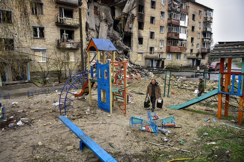 A playground near a damaged apartment block in Horenka village, Ukraine. EPA