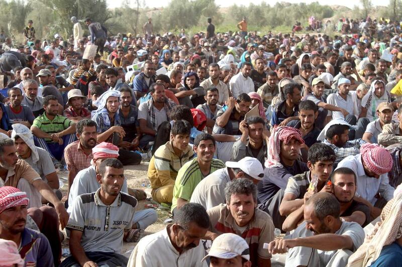 Displaced Iraqis from the city of Fallujah rest at a safe zone on June 17, 2016 after they were evacuated by Iraqi government forces due to continuing fighting to retake the city from ISIL. Moadh Al-Dulaimi / Agence France-Presse 