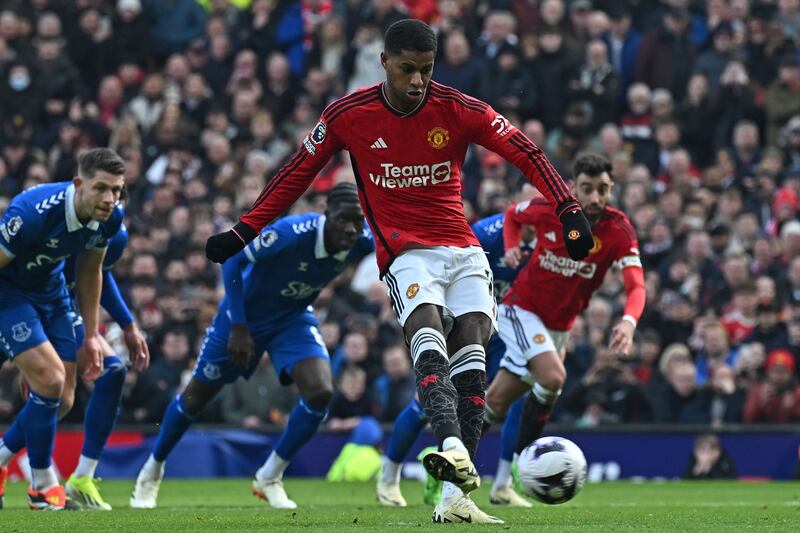 Marcus Rashford scores the second goal from the penalty spot against Everton. AFP