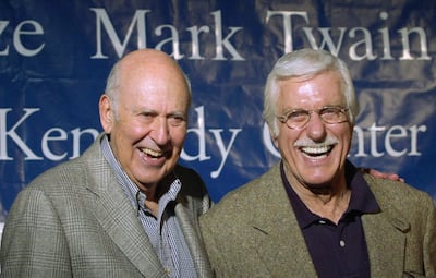 (FILES) In this file photo Kennedy Center Mark Twain Prize recipient comedian, director and producer Carl Reiner (L) answers questions with actor Dick Van Dyke during a press conference at the rehearsal for the celebration   October 24, 2000 at the Kennedy Center in Washington,DC. Carl Reiner, a revered and versatile comedy entertainer who won nine Emmies and stayed active into the 1990s with roles in movies such as the "Ocean's Eleven" franchise, has died at the age of 98. Showbiz friends of the writer, actor, director and producer confirmed his death, which news reports said came the night of June 30, 2020 of natural causes at his home in Beverly Hills. / AFP / JOYCE NALTCHAYAN
