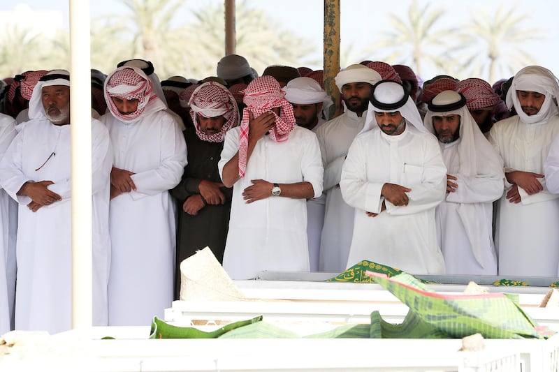 FUJAIRAH , UNITED ARAB EMIRATES , JAN 22 – 2018 :- Relatives and friends during the prayer at the funeral of seven Emirati children four girls and three boys who died of smoke inhalation on Monday morning house fire at Rul Dhadna village in Fujairah.  (Pawan Singh / The National) For News. Story by Ruba Haza