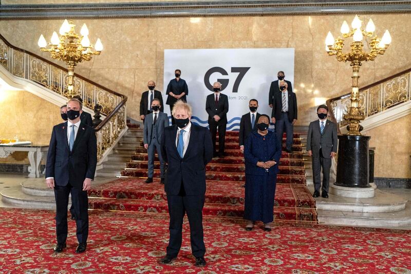 A handout picture released by the European Commission shows Britain's Prime Minister Boris Johnson (C) and Britain's Foreign Secretary Dominic Raab (2L), posing for a family photograph with other delegates during the G7 foreign ministers meeting in London on May 5, 2021. G7 foreign ministers meet in London for their first face-to-face talks in more than two years, with calls for urgent joined-up action to tackle the most pressing global threats. - RESTRICTED TO EDITORIAL USE - MANDATORY CREDIT "AFP PHOTO / Niklas Halle'n / European Commission" - NO MARKETING - NO ADVERTISING CAMPAIGNS - DISTRIBUTED AS A SERVICE TO CLIENTS
 / AFP / European Commission / Niklas HALLE'N / RESTRICTED TO EDITORIAL USE - MANDATORY CREDIT "AFP PHOTO / Niklas Halle'n / European Commission" - NO MARKETING - NO ADVERTISING CAMPAIGNS - DISTRIBUTED AS A SERVICE TO CLIENTS
