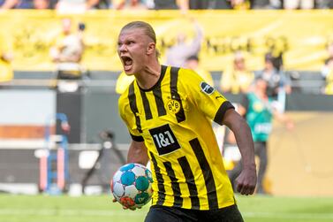 Dortmund's Erling Haaland celebrates during the German Bundesliga soccer match between Borussia Dortmund and Hertha BSC Berlin in Dortmund, Germany, Saturday, May 14, 2022.  (David Inderlied / dpa via AP)