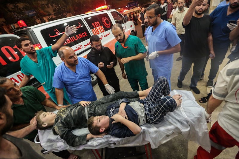 Palestinians injured in Israeli air raids arrive at Nasser Medical Hospital in Khan Younis, Gaza. Getty Images