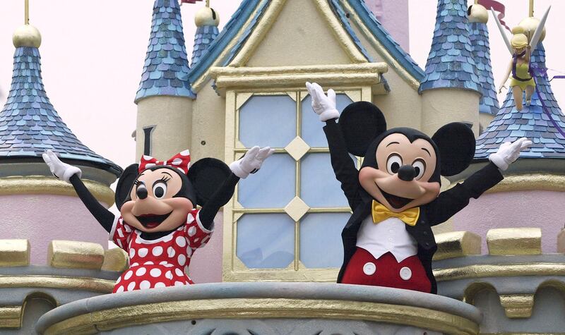 HONG KONG - SEPTEMBER 11:  Disney characters Mickey Mouse and Minnie Mouse perform during  the parade at Hong Kong Disneyland  on September 11, 2005 in Hong Kong. The new theme park is scheduled to have its grand opening September 12.  (Photo by MN Chan/Getty Images)