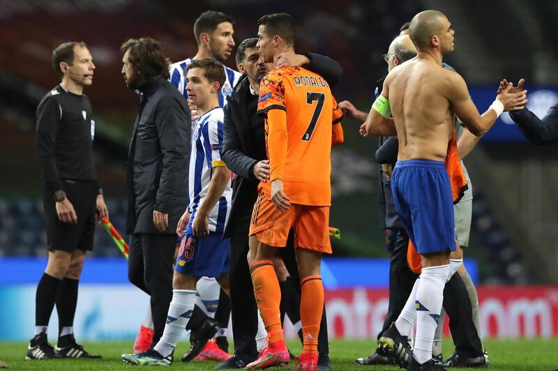 Porto coach Sergio Conceicao (C-L) and Cristiano Ronaldo (C-R) after the match. EPA