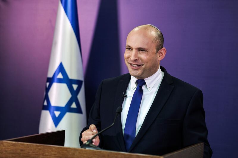 epa09251766 Naftali Bennett, member of the Israeli 'Knesset' parliament and leader of the Yamina party, gives a statement at the Knesset in Jerusalem, 06 June 2021. The country is in a phase of transition from the government of Prime Minister Benjamin Netanyahu to a new government led by Naftali Bennett, who served as minister in various functiions in Netanyahu's cabinet. The Israeli 'Knesset' parliament is expected to vote on the governmental change on 09 June 2021.  EPA/MENAHEM KAHANA / POOL