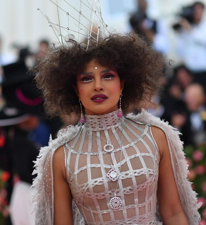 Actress Priyanka Chopra resembled a Disney queen, with her white and mauve lined eyes, dusted brows and dainty crown set atop her voluminous curls. AFP