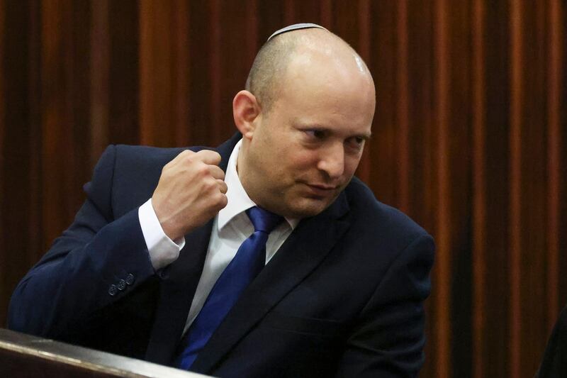 Yamina party leader Naftali Bennett gestures during a special session of the Knesset whereby Israeli lawmakers elect a new president, at the plenum in the Knesset, Israel's parliament, in Jerusalem Wednesday, June 2, 2021. (Ronen Zvulun/Pool Photo via AP)