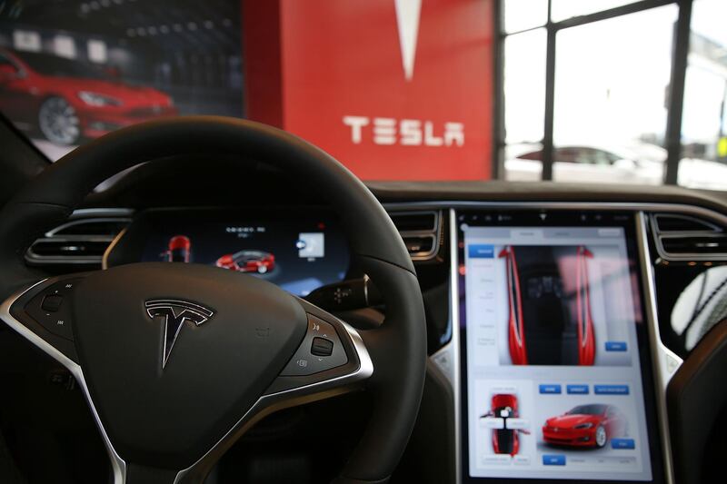 (FILES) In this file photo taken on July 5, 2016 The inside of a Tesla vehicle is viewed as it sits parked in a new Tesla showroom and service center in Red Hook, Brooklyn in New York City.  The first driverless cars were supposed to be deployed on the roads of American cities in 2019, but just a few days before the end of the year, the lofty promises of car manufacturers and Silicon Valley remain far from becoming reality.  Recent accidents, such as those involving Tesla cars equipped with Autopilot, a driver assistance software, have shown that "the technology is not ready," said Dan Albert, critic and author of the book "Are We There Yet?" on the history of the American automobile.  / AFP / GETTY IMAGES NORTH AMERICA / SPENCER PLATT
