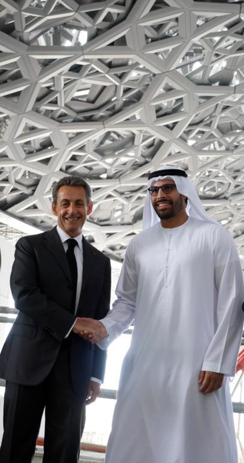 Mohammed Al Mubarak, Chairman of Abu Dhabi Tourism & Culture Authority welcomes Nicolas Sarkozy, former French president for a tour of the Louvre Abu Dhabi's construction site on Wednesday. Courtesy TDIC