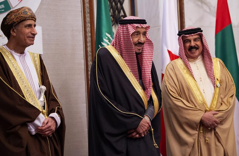 King Salman bin Abdulaziz of Saudi Arabia stands between his bahraini counterpart Hamad Al-Khalifa  and Omani Deputy Prime Minister Fahd bin Mahmud al-Said. AFP / Saudi Royal Palace