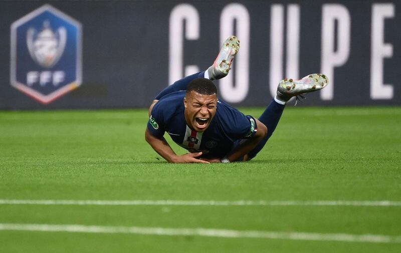 Paris Saint-Germain forward Kylian Mbappe after being fouled by Saint Etienne captain Loic Perrin during the French Cup final  at the Stade de France on Friday, July 24. Perrin was sent-off for the challenge and Mbappe will be out of action for three weeks. AFP