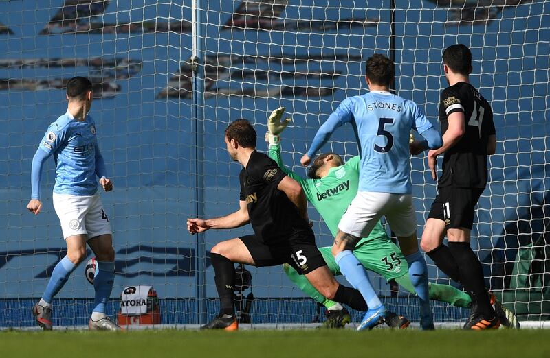 John Stones of Manchester City scores his team's second goal past Darren Randolph of West Ham. getty