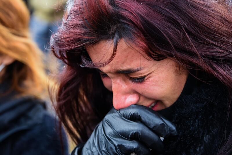 A woman weeps during a burial service for Yazidi victims of ISIS in the northern Iraqi village of Kocho. AFP