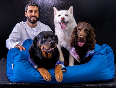 Posh Pets owner Mansoor Al Hammadi with his dogs Leila, left, Luna and Gucci. Victor Besa / The National